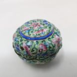 A Canton enamel pot and cover, decorated flowers on a green ground, 3 cm diameter see images