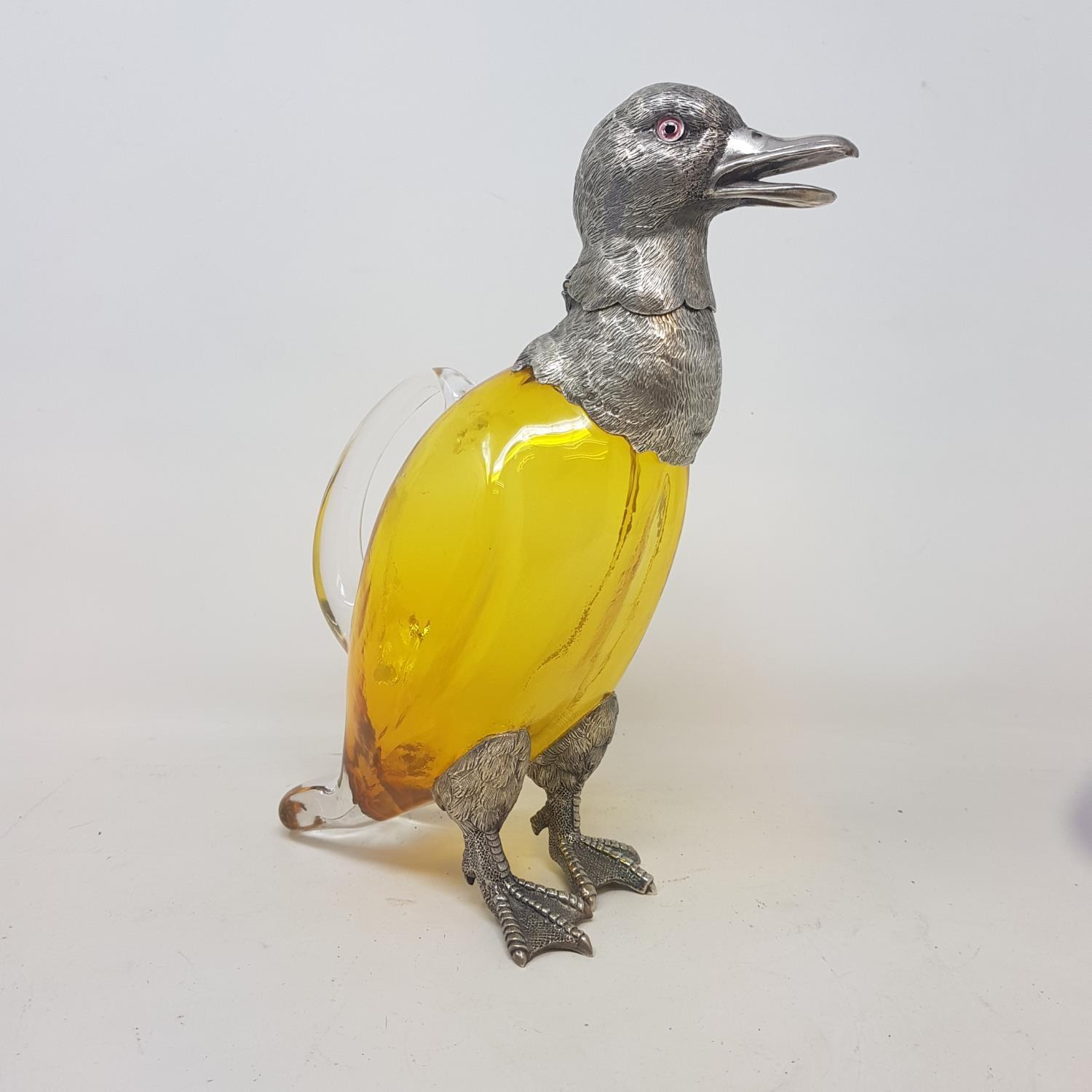 A modern silver plated and amber glass claret jug, in the form of a duck, 28 cm high Report by JS