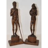A pair of carved wood Australian figures, signed F Rents, 38 cm high