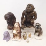 A pottery figure of a monkey, 17 cm, and seven others (8)
