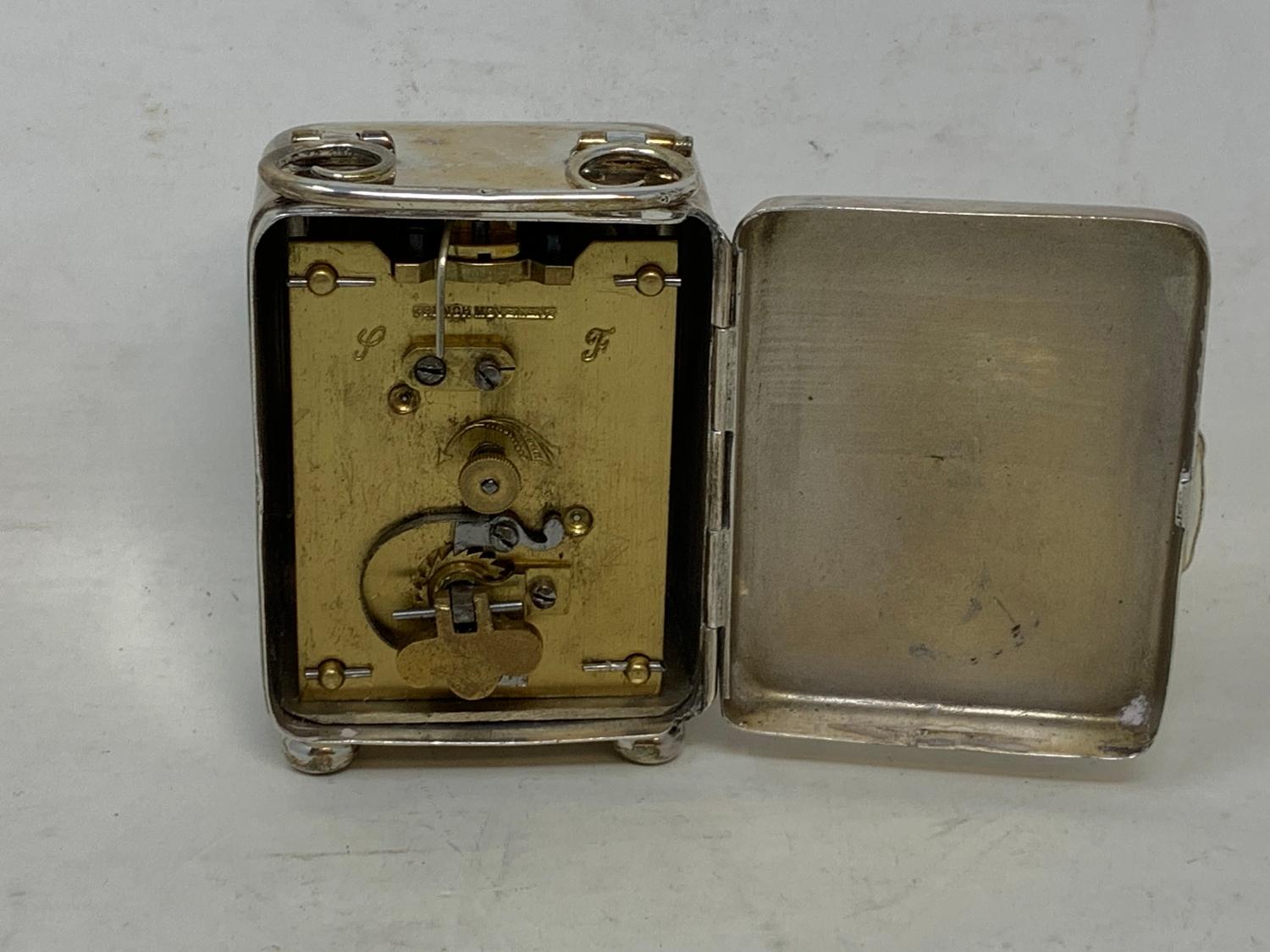 An Edward VII travelling clock, the 3.5 cm dial with Arabic numerals, in a silver case, inscribed - Image 7 of 9