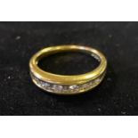 ***Withdrawn***An 18ct gold and channel set diamond ring, approx. ring size N½, 4.3 g (all in)