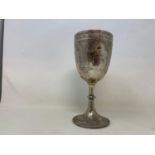A Victorian silver trophy goblet, indistinctly inscribed, and decorated flowers and foliage,
