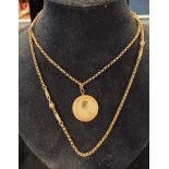 A Victorian yellow coloured metal long guard chain, with a pendant Report by RB no marks, not