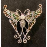 A silver butterfly brooch/pendant, with rubies