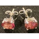 A pair of oval pink tourmaline stud earrings, set in silver
