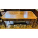 An Edwardian oak kitchen style table, having two frieze drawers, on turned legs, 187 cm wide