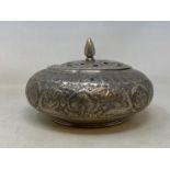 A Persian silver coloured metal pot pourri bowl and cover, decorated flowers and foliage, 19 cm