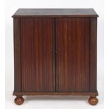 An unusual mahogany folio cabinet, the tambour front sliding to reveal two rows of twelve drawers,