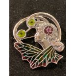 An Art Nouveau style silver brooch/pendant, in the form of a lady's face