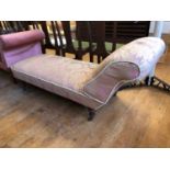 A Victorian upholstered chaise longue, on turned feet