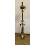 An Art Nouveau brass standard lamp, adapted to electricity, 128 cm high (excluding fitments)