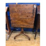 A 19th century yew tripod table, with a rectangular tilt top, 70 cm wide