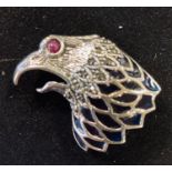 A silver eagle head brooch/pendant, with a ruby eye