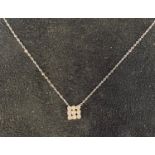 A white gold diamond pendant, on a chain