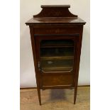 An Edwardian mahogany music cabinet, inlaid with musical instruments and foliage, 53.5 cm wide,