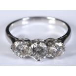 An 18ct white gold and three stone diamond ring, approx. 1.45ct, approx. ring size N