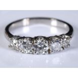 A white coloured metal and five stone diamond half hoop ring, approx. ring size N, diamonds