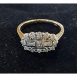 A yellow coloured metal and diamond cluster ring, set baguette and brilliant cut diamonds, approx.