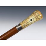A late 17th/early 18th century walking stick, with a carved ivory pique decorated handle, on a