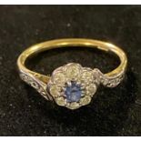 A yellow coloured metal and sapphire cluster ring, marks indistinct, approx. ring size T, 3.4 g (all