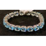 A modern silver coloured metal and topaz bracelet Report by JS Note: this is 20th/21st century
