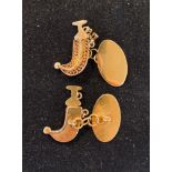 A pair of yellow coloured metal Jambiya cufflinks Report by RB not tested, carat unknown 6.5 g