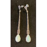 A pair of silver and opal long drop earrings Report by RB Modern