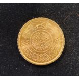 A Saudi Arabia guinea (pound) gold coin, 8.0 g