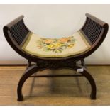 An Edwardian X framed stool, carved foliage, 56 cm wide