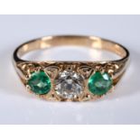 A 9ct gold, emerald and three stone diamond ring, approx. ring size P½ Please note 9ct generally