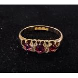 An 18ct gold, ruby and diamond chip ring, approx. ring size L Generally good condition, centre