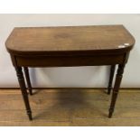 An early 19th century mahogany D shaped card table, on tapering turned legs, 91 cm wide