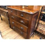 A late Victorian walnut chest, of five drawers, with carved fruit handles, 104 cm wide