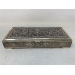 A Persian silver coloured metal table cigarette box, decorated birds, flowers and foliage, 16 cm