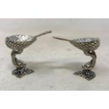 A pair of silver dolphin salts, with silver spoons Report by RB Modern, good condition, match
