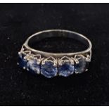 An 18ct gold and five stone sapphire half hoop ring, approx. ring size Q½, 3.9 g (all in),