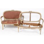 A pair of Louis XVI style painted two seater settees, the backs carved ribbons, on tapering fluted