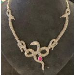 A silver, marcasite and ruby set snake necklace