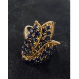 ***Withdrawn***An 18ct gold and sapphire tulip ring, approx. ring size S½, apparently unmarked, 10.1