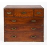 A Victorian teak secretaire campaign chest, in two parts, having a secretaire drawer, the interior