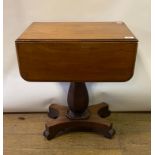 An early Victorian mahogany work table, with one real and one false drawer, on an octagonal baluster