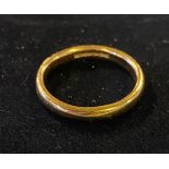 A 22ct gold wedding band, 6.1 g This ring is size: R