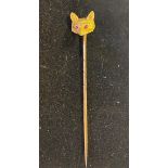 An 18ct gold fox head stick pin, with garnet eyes, 4.2 g