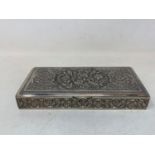 A Persian silver coloured metal table cigarette box, decorated birds, flowers and foliage, 16.5 cm
