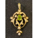 An Edwardian 15ct gold and seed pearl pendant, 4 cm high Report by RB 3.6 g (all in) Lacks a seed