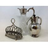 A silver cream jug, marks rubbed, 3.5 ozt, a silver part dressing table set and assorted silver