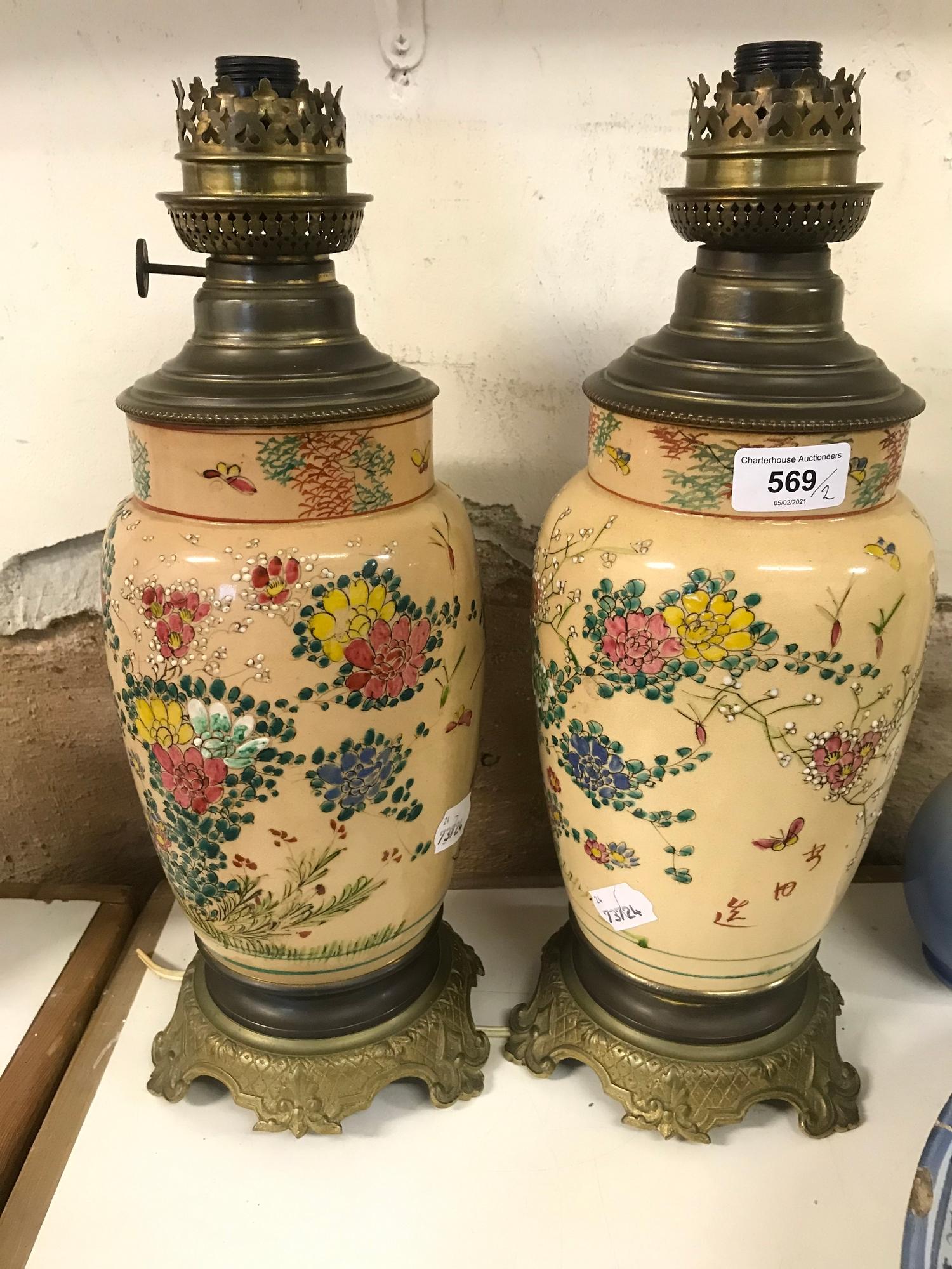 A pair of Japanese Satsuma pottery lamps, with brass mounts, 39 cm high (2)