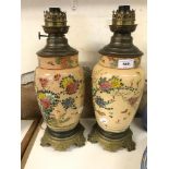 A pair of Japanese Satsuma pottery lamps, with brass mounts, 39 cm high (2)