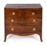An early 19th century bowfront mahogany chest of small proportions, of two short and two long